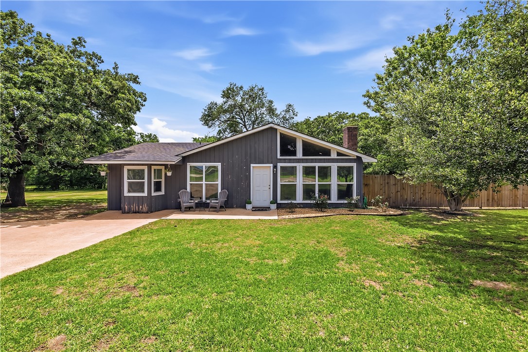 8132 Scasta Road Bryan, TX 77808 - Photo 1 of 1 a front view of a house with a garden