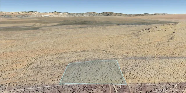 a view of an ocean beach and mountain