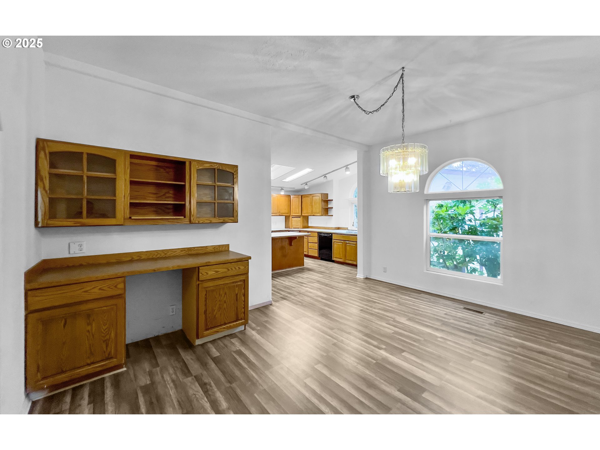 100 Seagrove Loop Lincoln City, OR 97367 - Photo 6 of 36 a kitchen view with wooden floors wooden cabinets and entryway