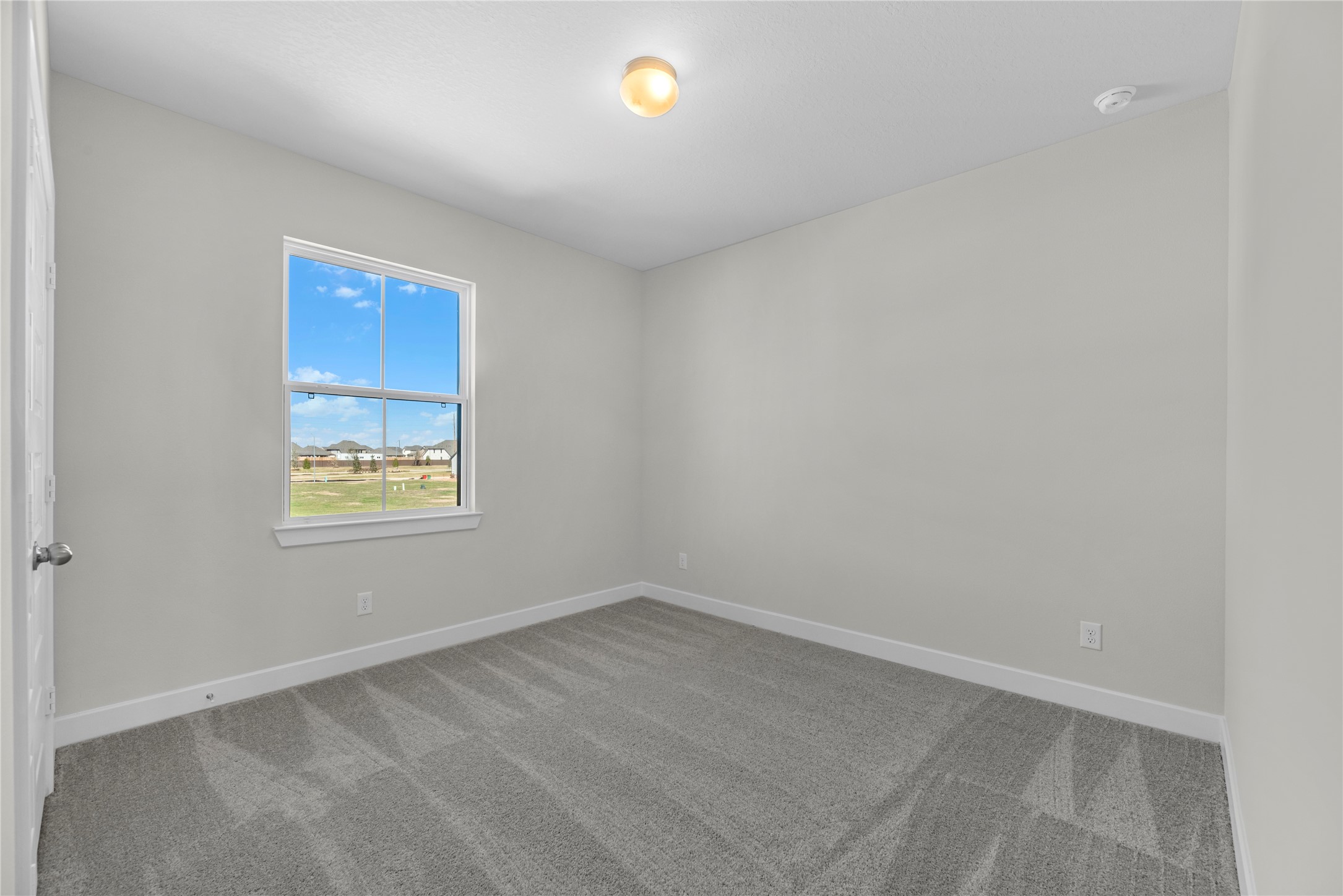 5023 Nesbit Path Rosenberg, TX 77471 - Photo 18 of 25 a view of an empty room with a window