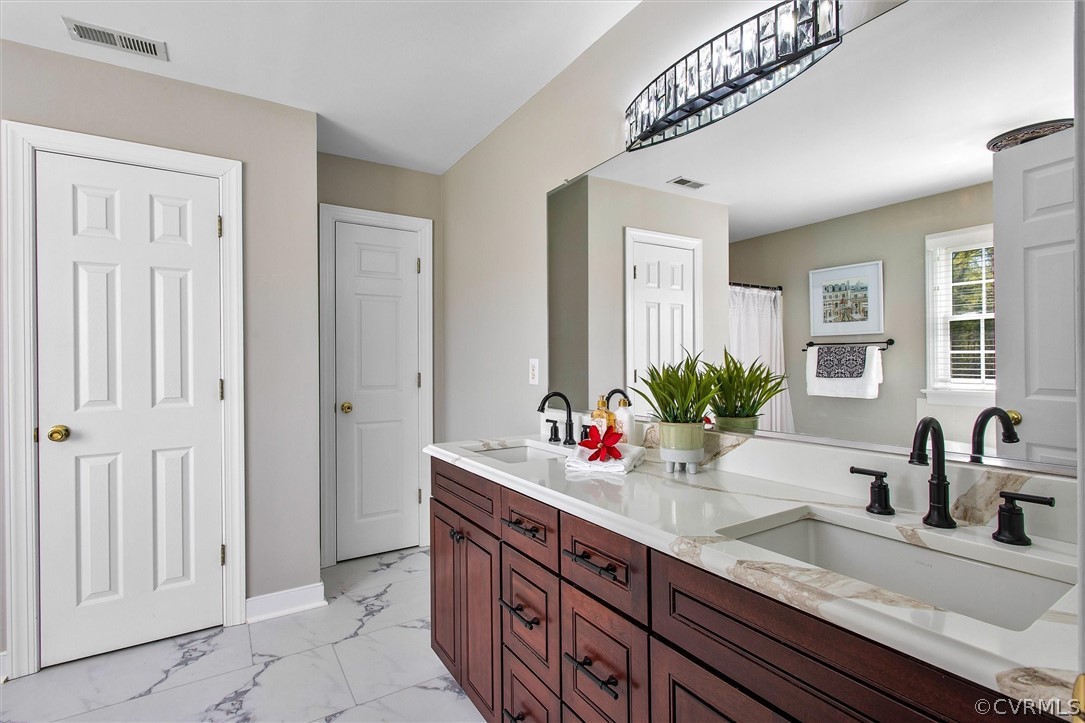 17312 Parsons Ridge Road Beaverdam, VA 23015 - Photo 29 of 49 a bathroom with sink and mirror
