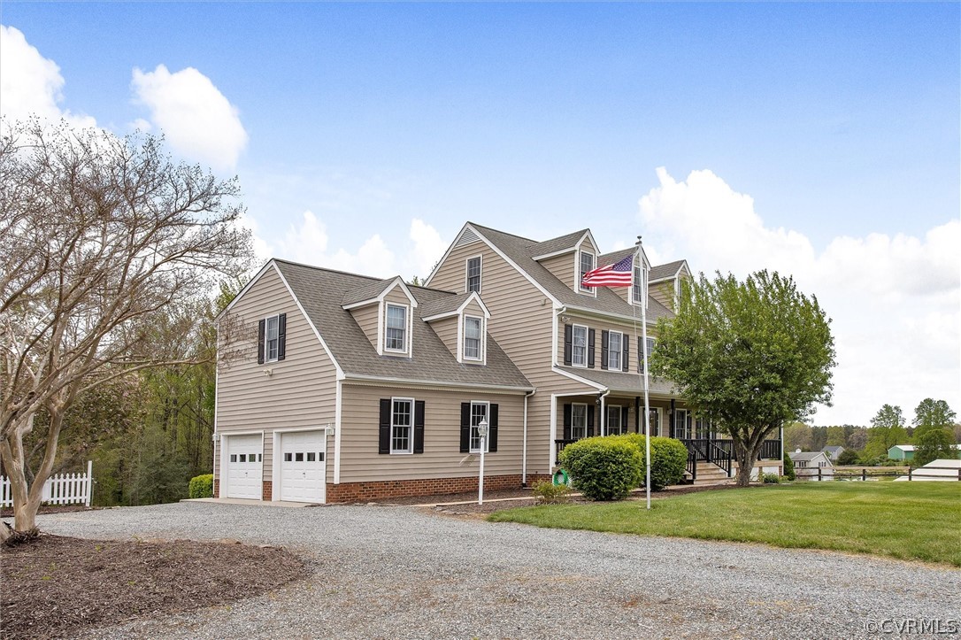 17312 Parsons Ridge Road Beaverdam, VA 23015 - Photo 4 of 49 a front view of a house with a garden and plants