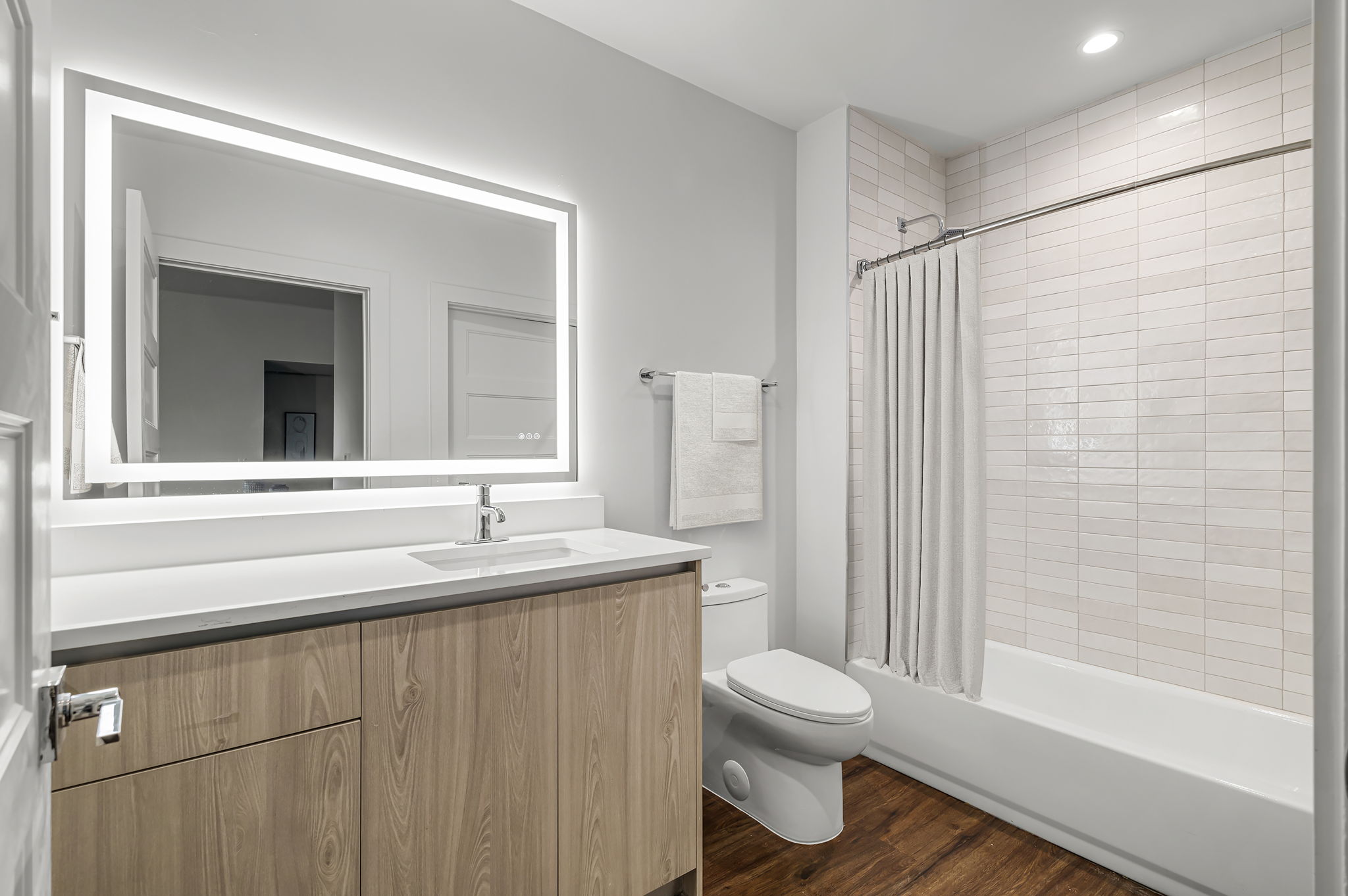 5515 Humming Bird Lane, Unit 309 Austin, TX 78745 - Photo 16 of 38 a bathroom with a sink toilet and shower