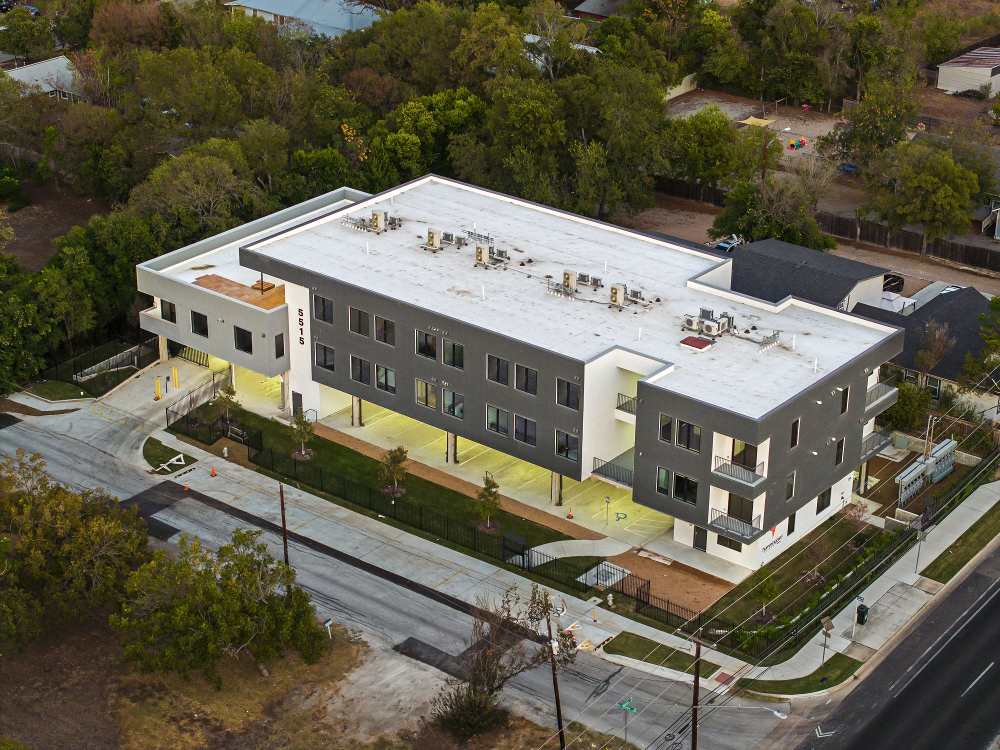 5515 Humming Bird Lane, Unit 309 Austin, TX 78745 - Photo 22 of 38 an aerial view of a balcony with a table and chairs