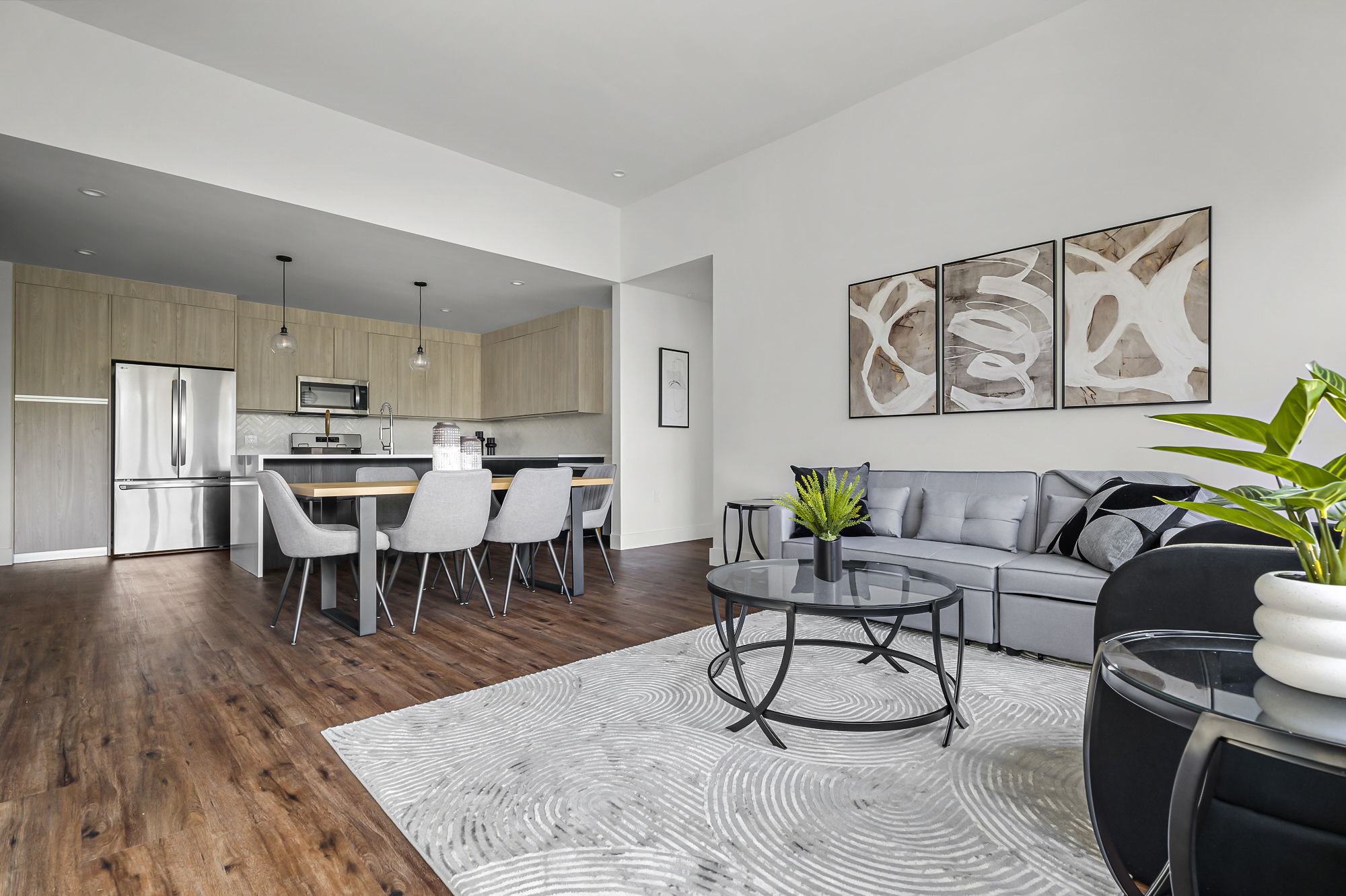 5515 Humming Bird Lane, Unit 309 Austin, TX 78745 - Photo 2 of 38 a living room with furniture and wooden floor
