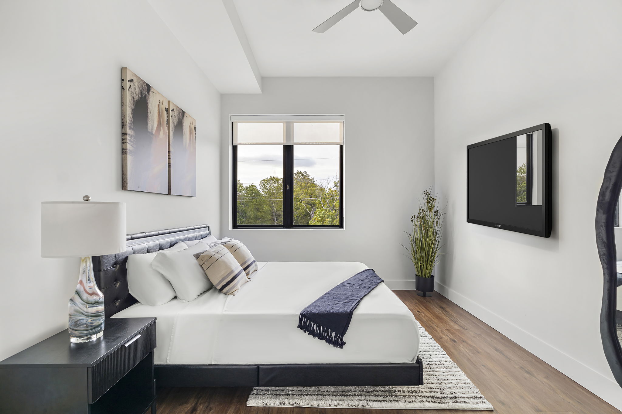 5515 Humming Bird Lane, Unit 309 Austin, TX 78745 - Photo 7 of 38 a living room with furniture and a flat screen tv