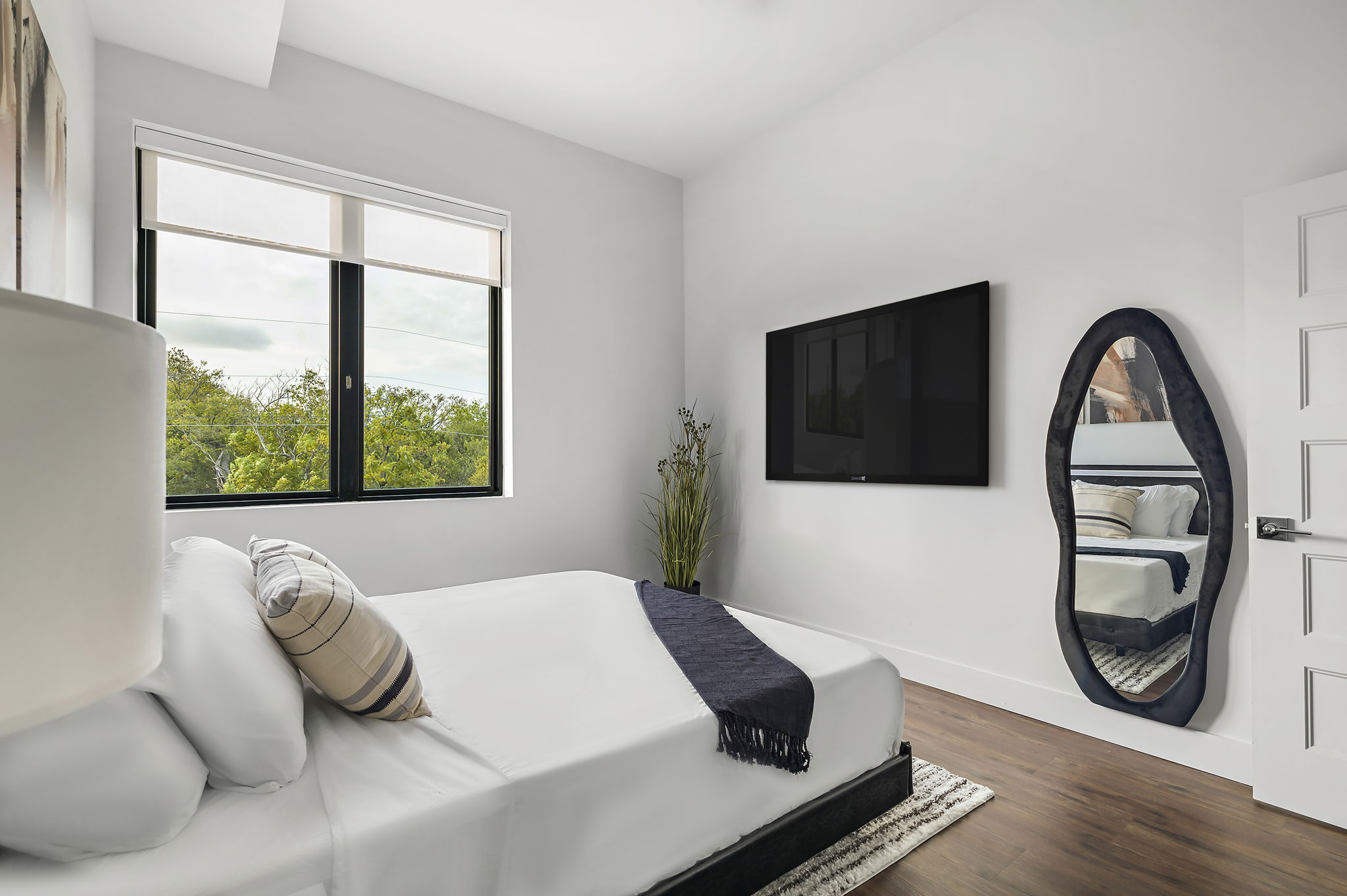 5515 Humming Bird Lane, Unit 309 Austin, TX 78745 - Photo 8 of 38 a bedroom with a bed and a window