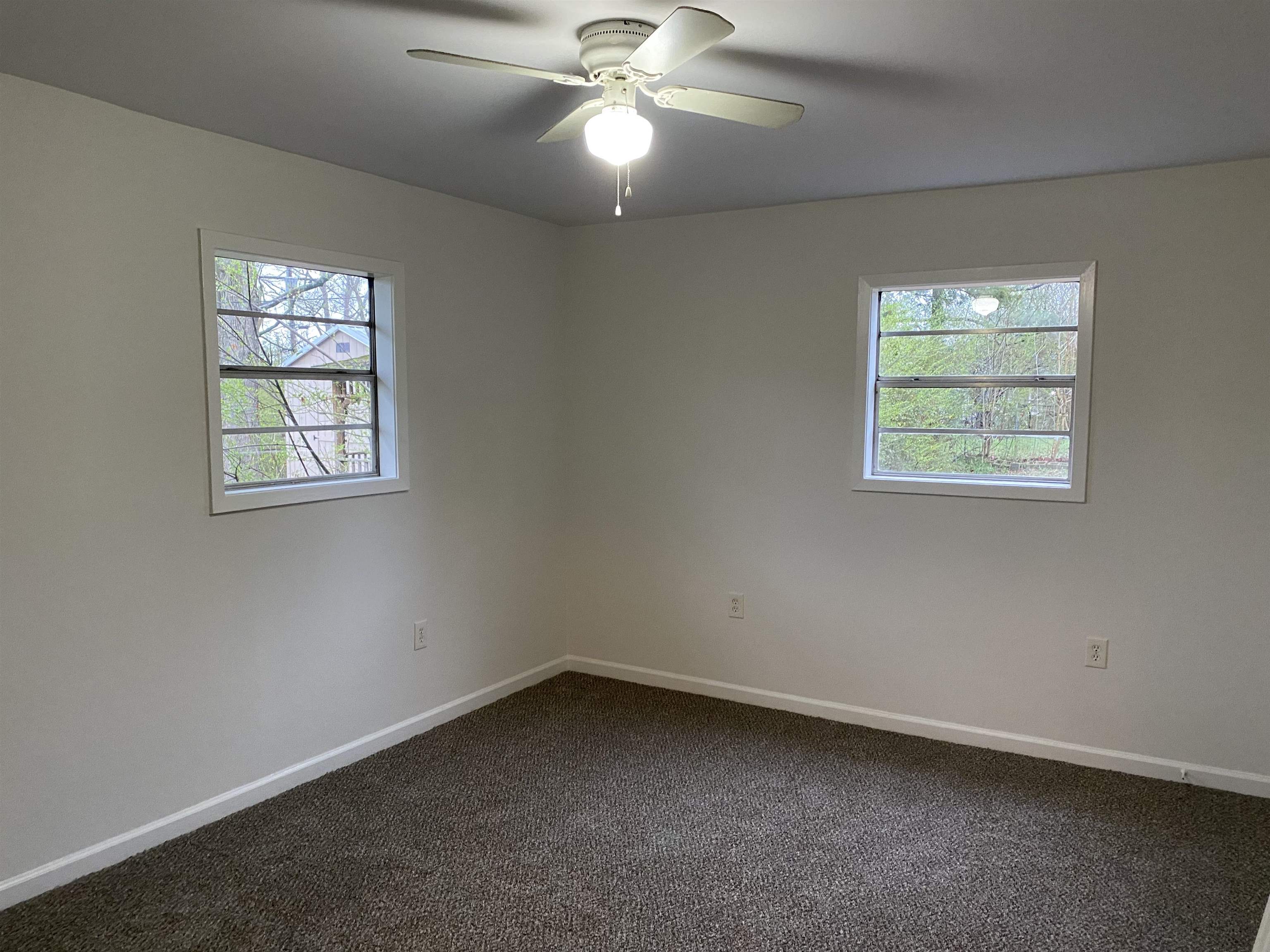 3499 Rochester Road Memphis, TN 38109 - Photo 3 of 13 2nd BR offers plenty of natural light, ceiling fan, and new carpet and paint.