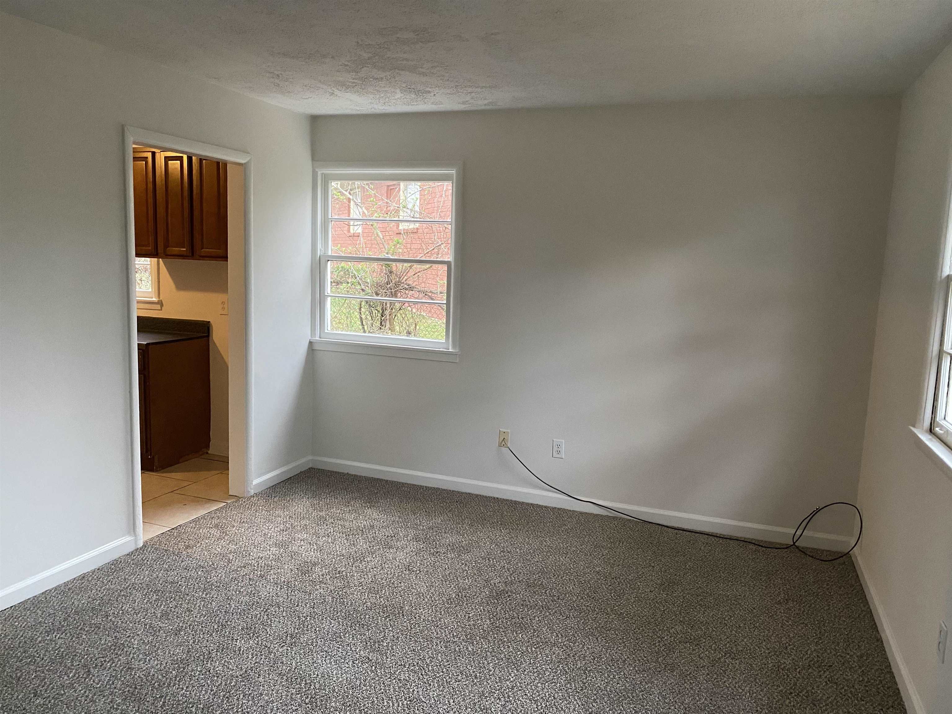 3499 Rochester Road Memphis, TN 38109 - Photo 7 of 13 Entry to the home leads you into the living room.