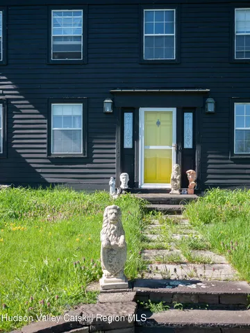 front view of a house with a yard