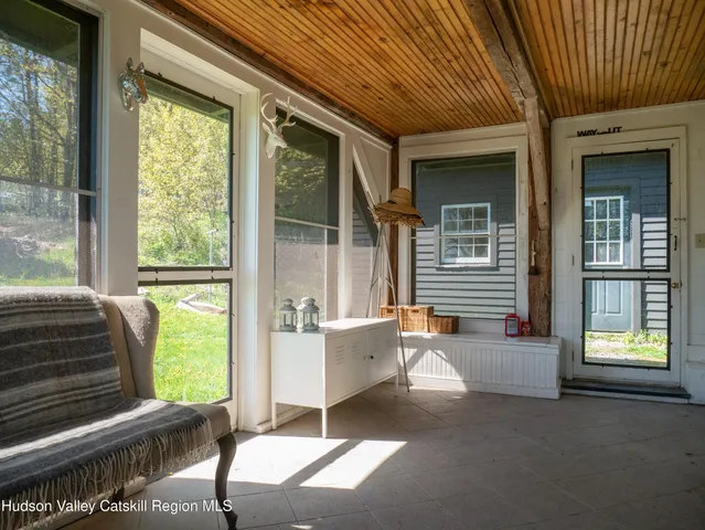 a spacious bedroom with a bed and a fireplace