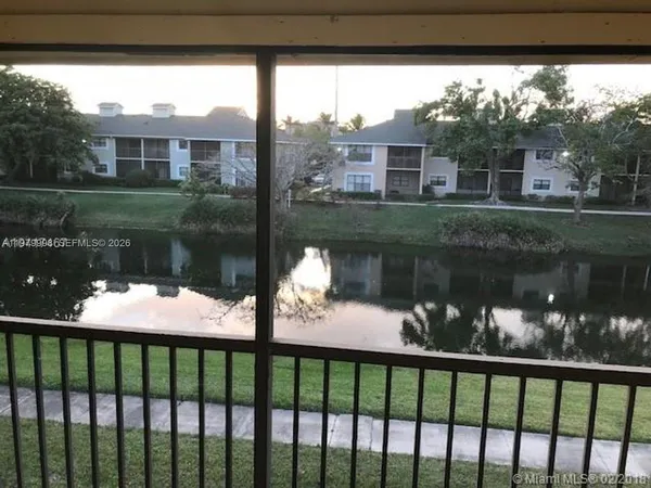 a view of a lake from a balcony