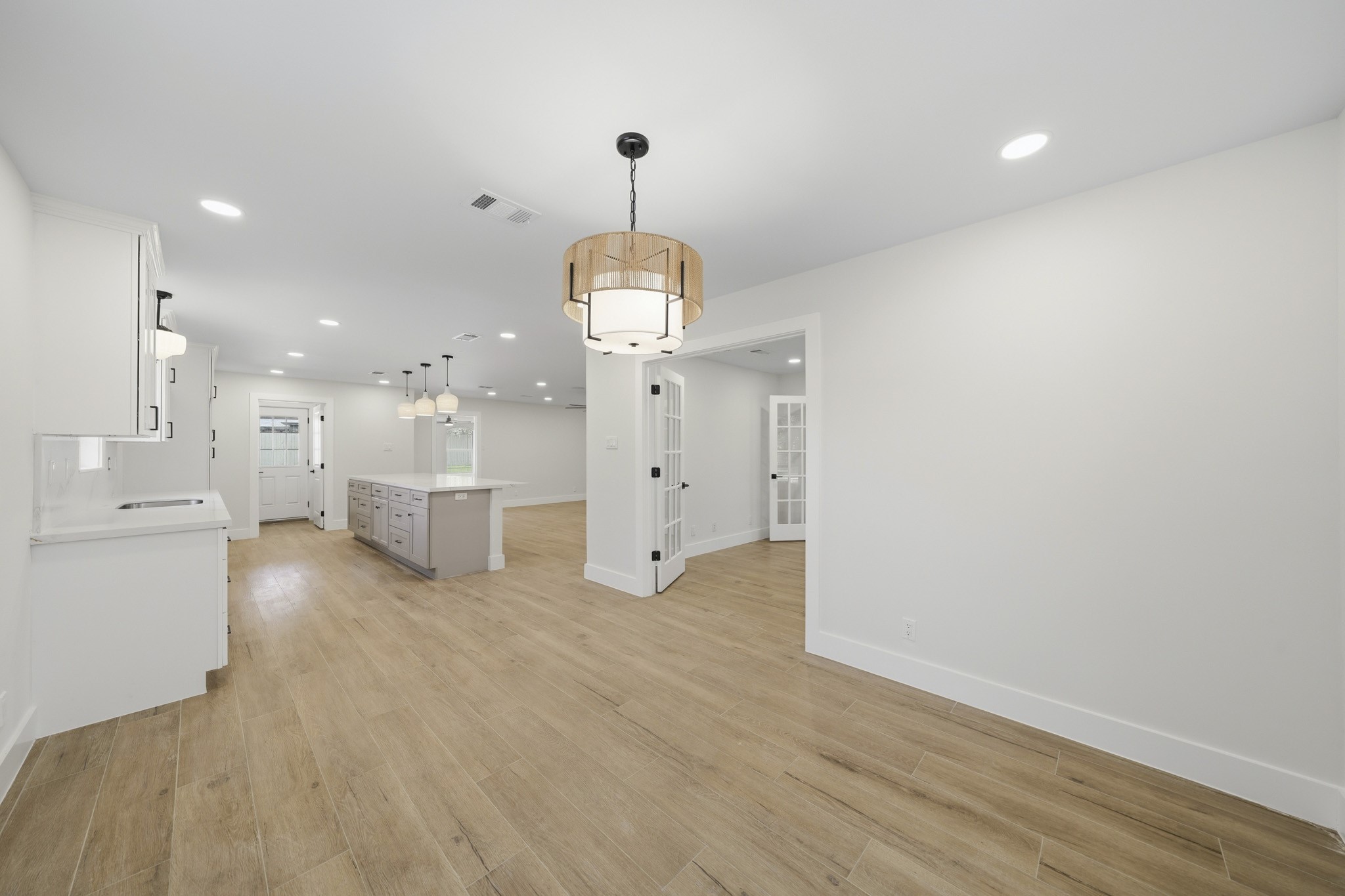 18918 Casper Drive Spring, TX 77373 - Photo 15 of 32 Beautiful lighting and easy access to the kitchen make entertaining effortless.