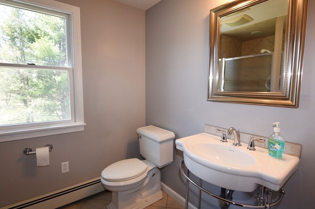 15 Furnace Street Marshfield, MA 02050 - Photo 12 of 41 a bathroom with a toilet sink and mirror