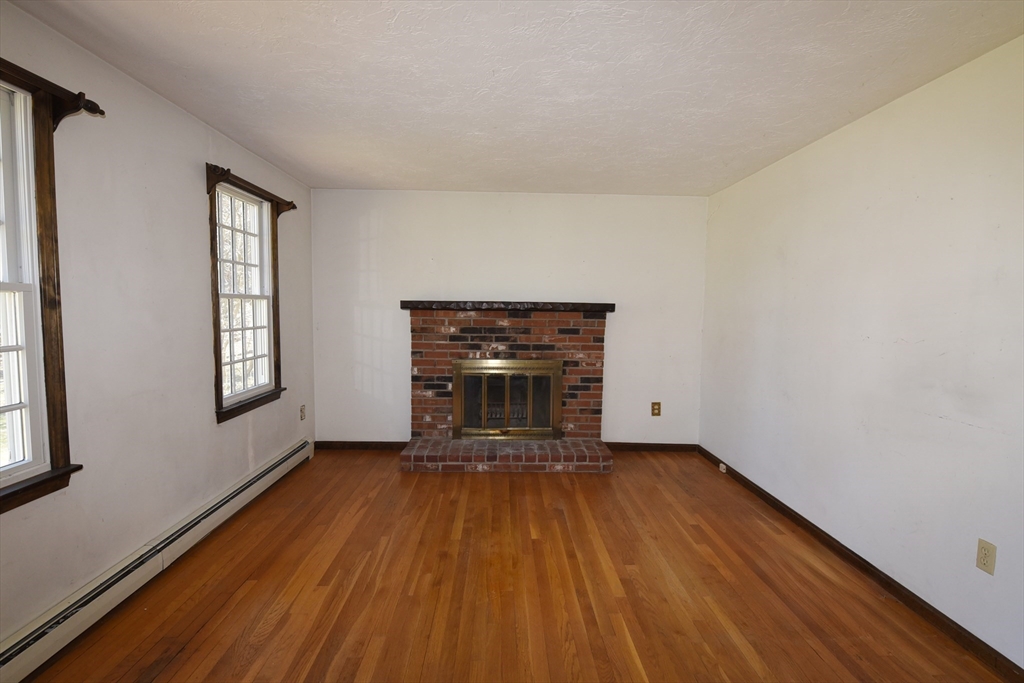 15 Furnace Street Marshfield, MA 02050 - Photo 18 of 41 a view of an empty room with window and wooden floor