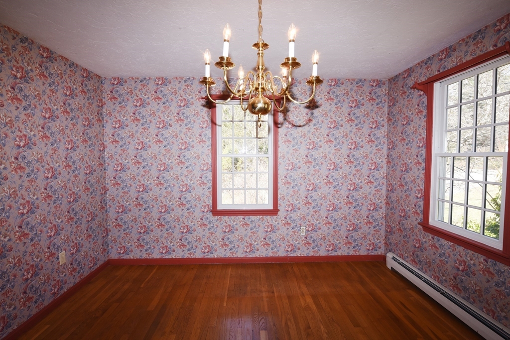 15 Furnace Street Marshfield, MA 02050 - Photo 22 of 41 a view of a livingroom with a chandelier wooden floor and a chandelier