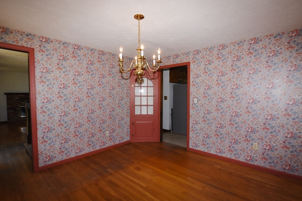 15 Furnace Street Marshfield, MA 02050 - Photo 23 of 41 a view of a hallway with wooden floor and a chandelier