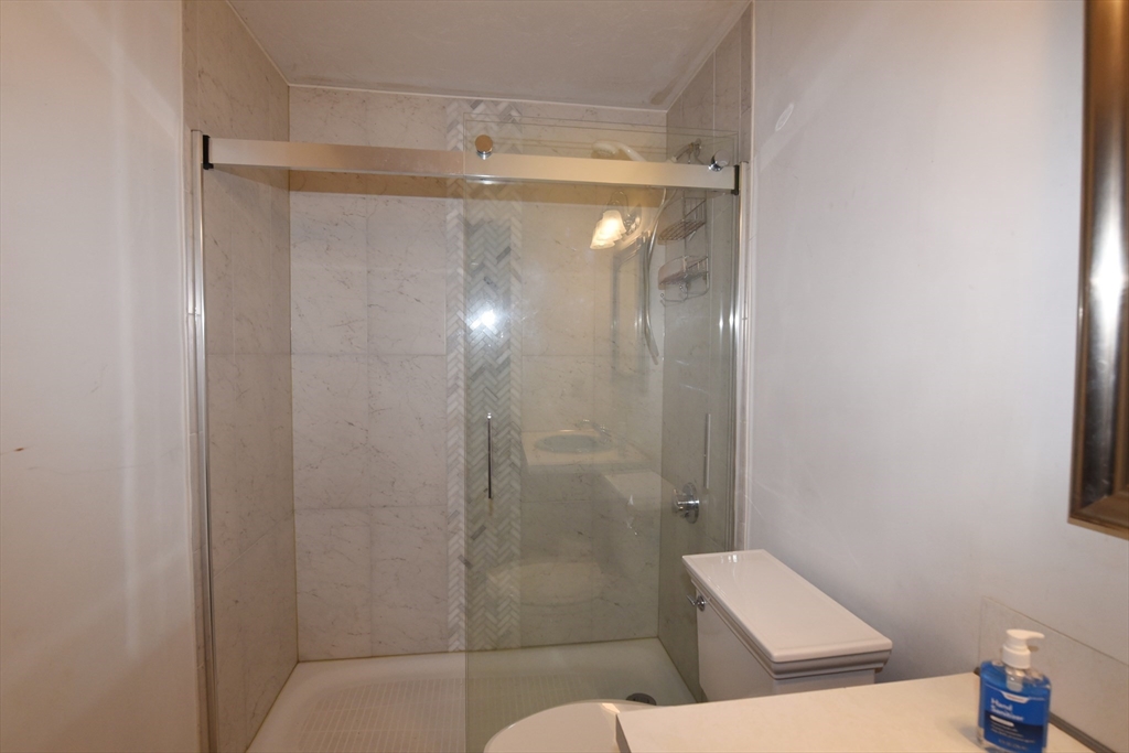 15 Furnace Street Marshfield, MA 02050 - Photo 28 of 41 a bathroom with a shower and toilet
