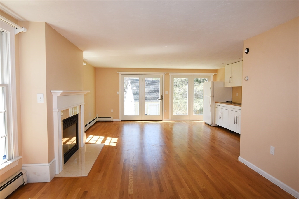 15 Furnace Street Marshfield, MA 02050 - Photo 31 of 41 a view of empty room with fireplace and wooden floor