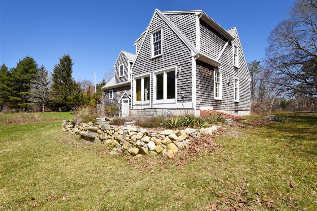 15 Furnace Street Marshfield, MA 02050 - Photo 5 of 41 a front view of a house with a yard