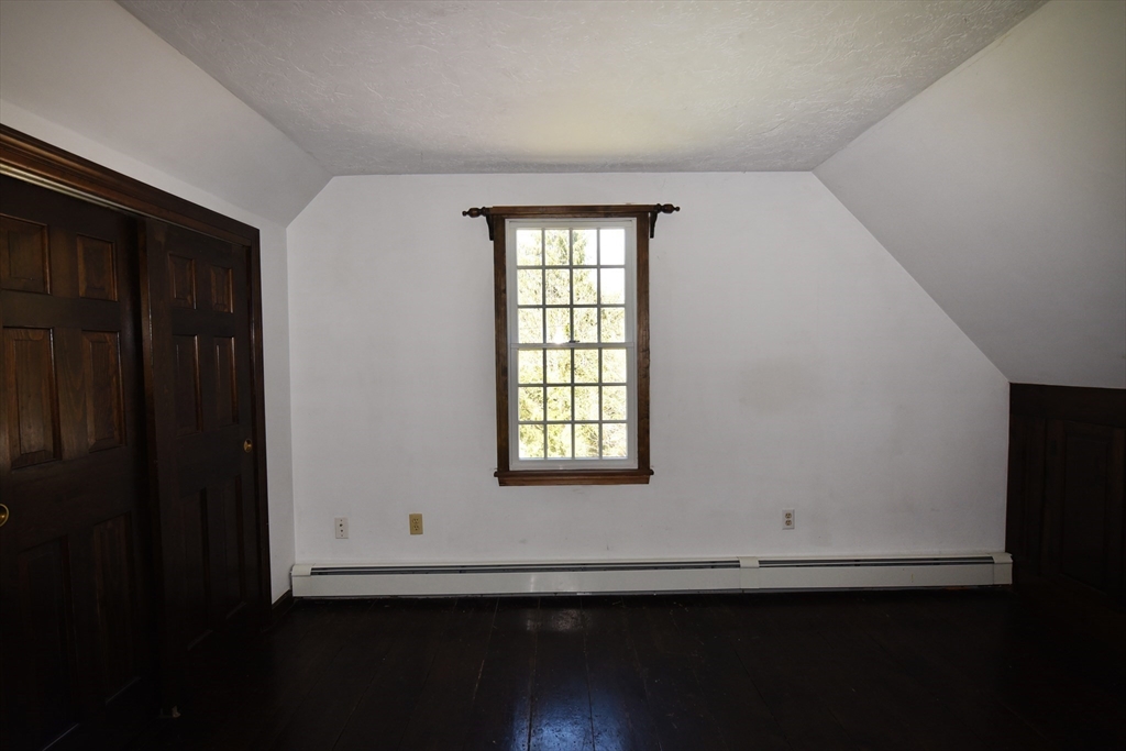 15 Furnace Street Marshfield, MA 02050 - Photo 10 of 41 a view of an empty room with wooden floor and a window