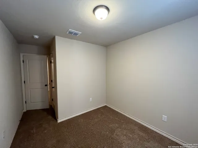 an empty room with a empty space and a window