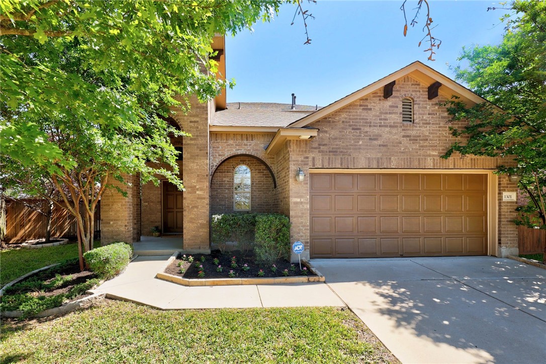 1301 Sunny Meadows Loop Georgetown, TX 78626 - Photo 1 of 1 a front view of a house with garden
