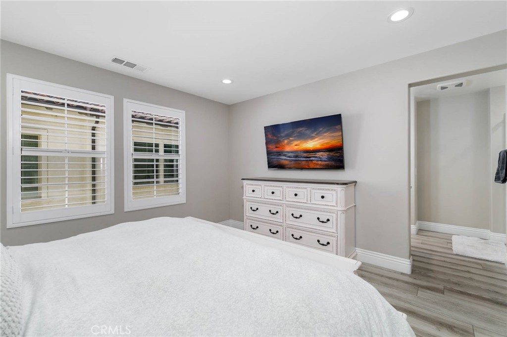 837 Iris Way, Unit C Azusa, CA 91702 - Photo 14 of 38 a living room with flat screen tv a lamp and a window