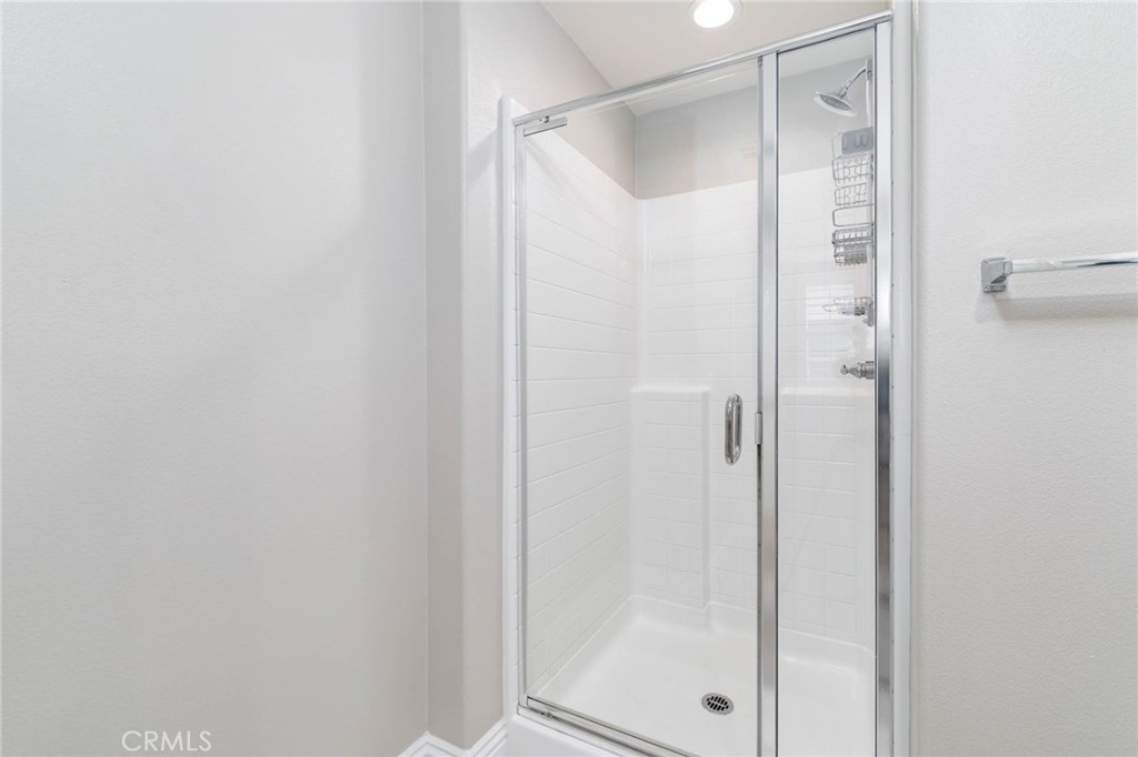 837 Iris Way, Unit C Azusa, CA 91702 - Photo 16 of 38 a bathroom with a glass shower door