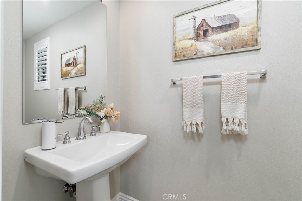 837 Iris Way, Unit C Azusa, CA 91702 - Photo 9 of 38 a bathroom with a sink and a mirror