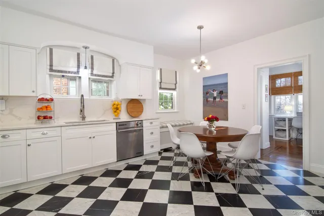 a kitchen with a checkered floor and a black white checkered floor