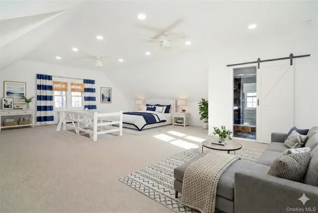 a view of a livingroom with furniture and staircase