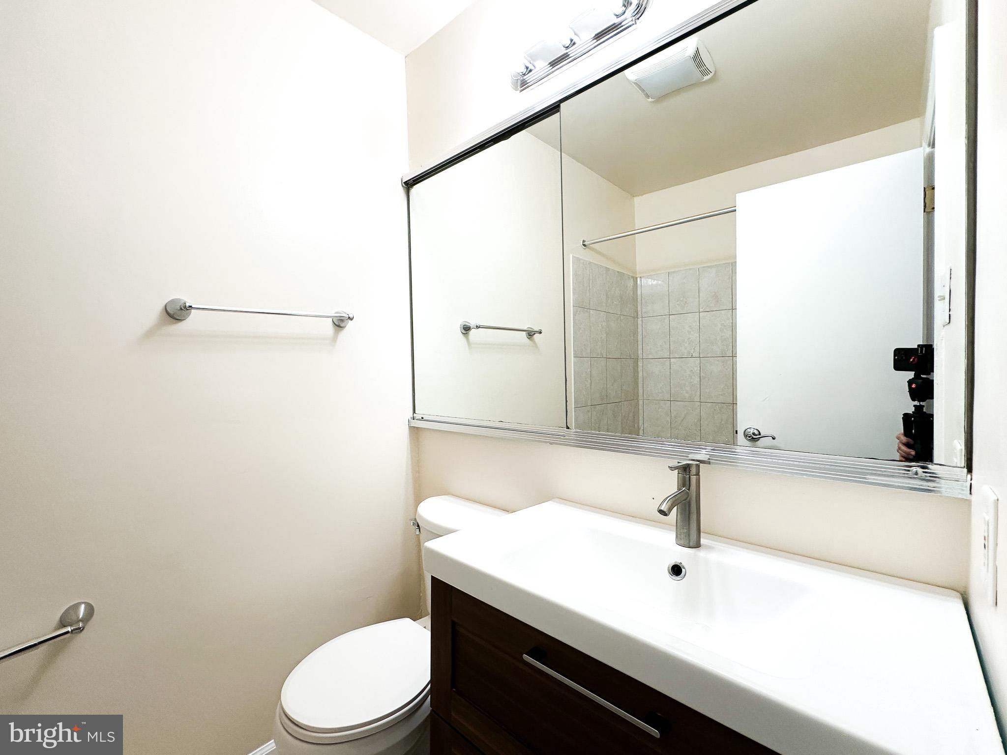 1803 Worthington Drive Exton, PA 19341 - Photo 17 of 27 a bathroom with a sink a toilet and shower