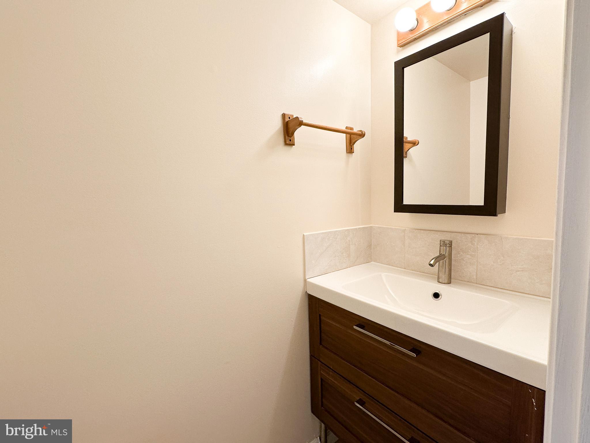 1803 Worthington Drive Exton, PA 19341 - Photo 20 of 27 a bathroom with a sink and a mirror