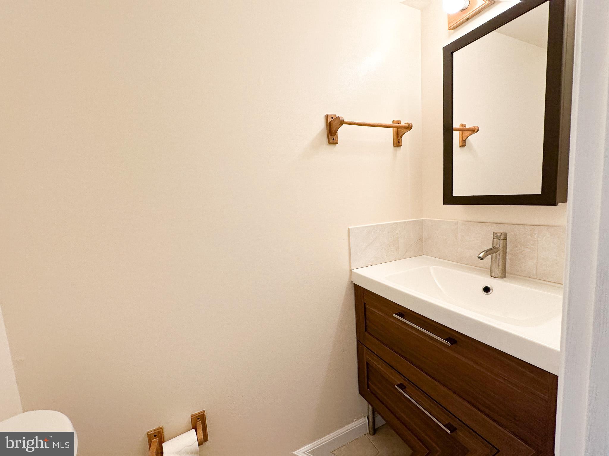 1803 Worthington Drive Exton, PA 19341 - Photo 21 of 27 a bathroom with a sink and a mirror