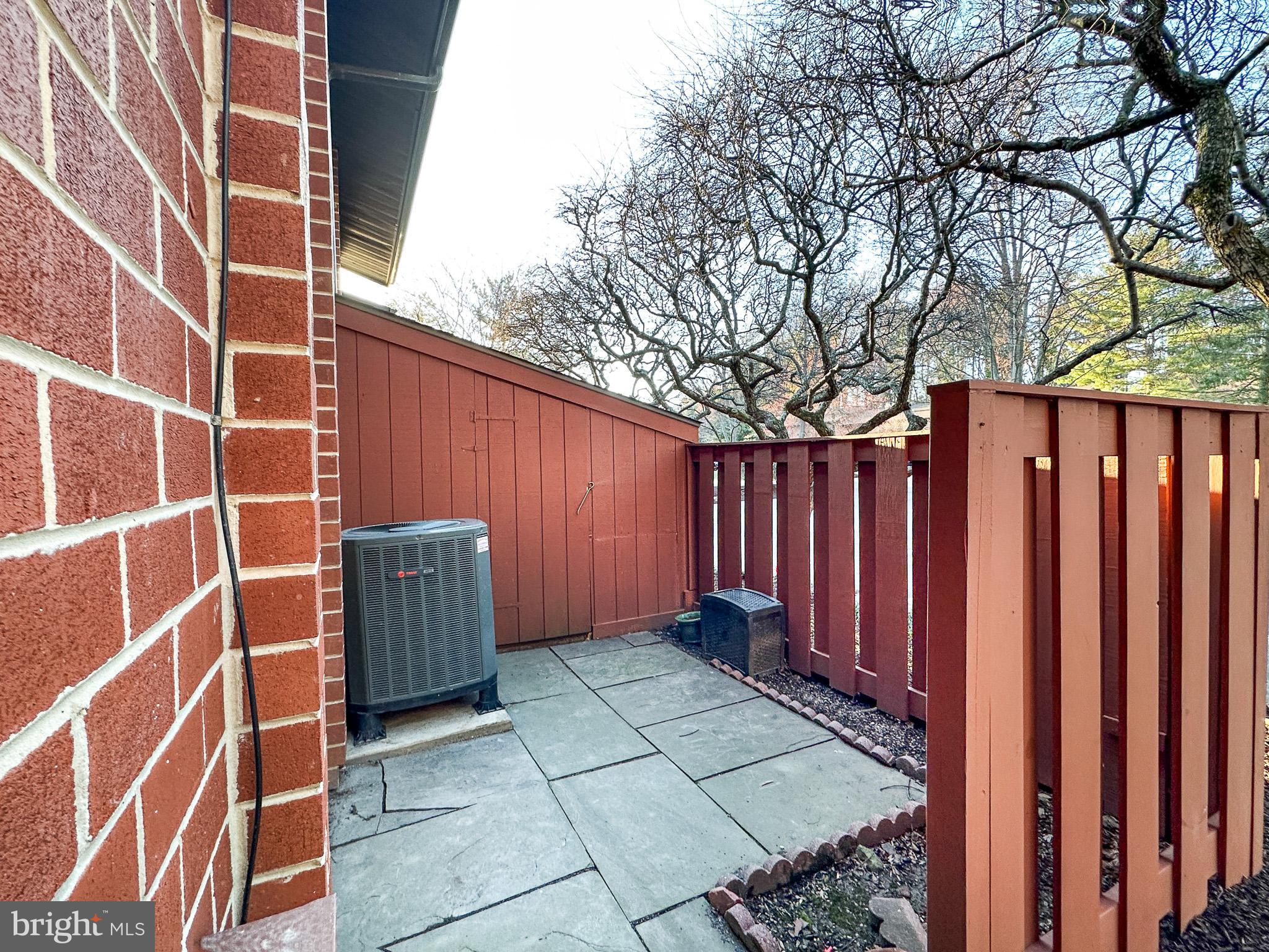 1803 Worthington Drive Exton, PA 19341 - Photo 26 of 27 a view of a backyard with wooden fence