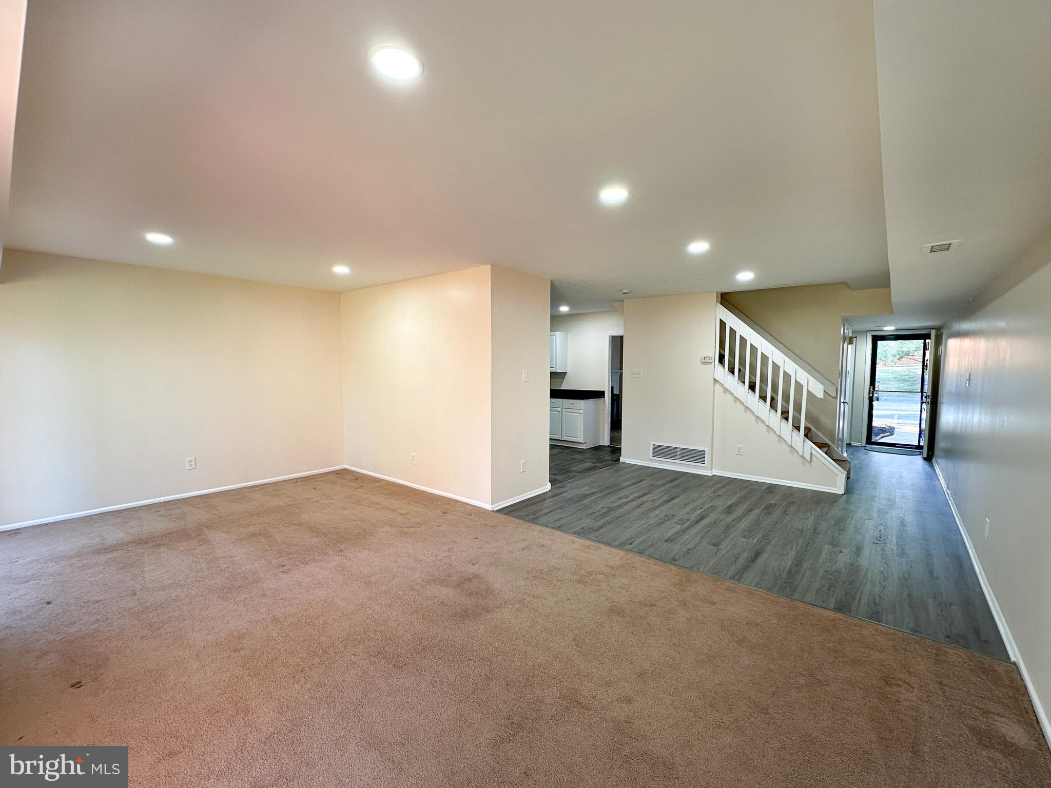 1803 Worthington Drive Exton, PA 19341 - Photo 10 of 27 a view of an empty room with wooden floor and a chandelier
