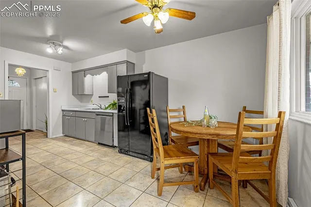 a spacious bedroom with a bed and a view of living room