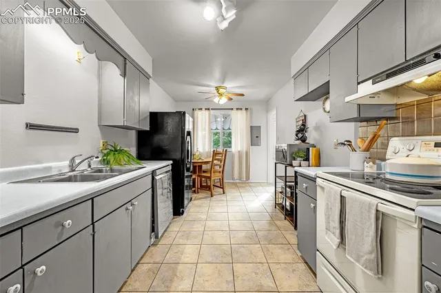 a view of a dining room with furniture and chandelier