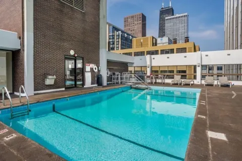 an aerial view of a house with swimming pool