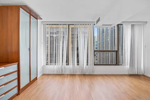 a view of wooden floor and brick walls