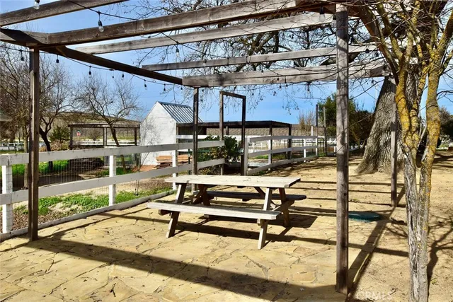 a view of a chairs and table in a patio