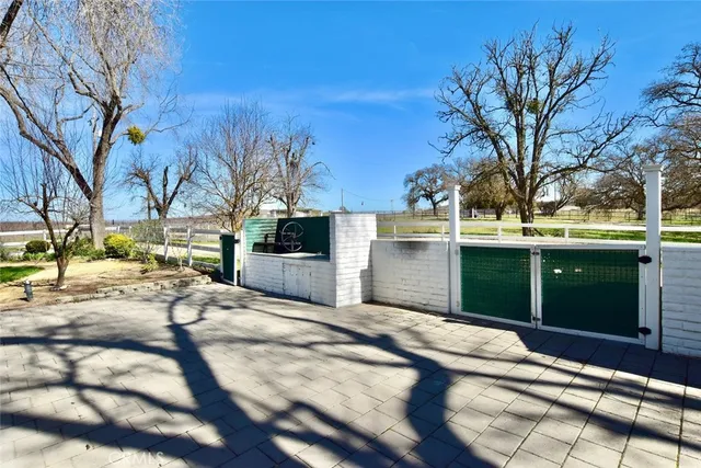 a view of a backyard of the house
