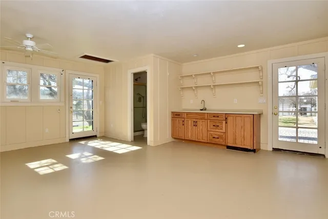 a view of an empty room with a window