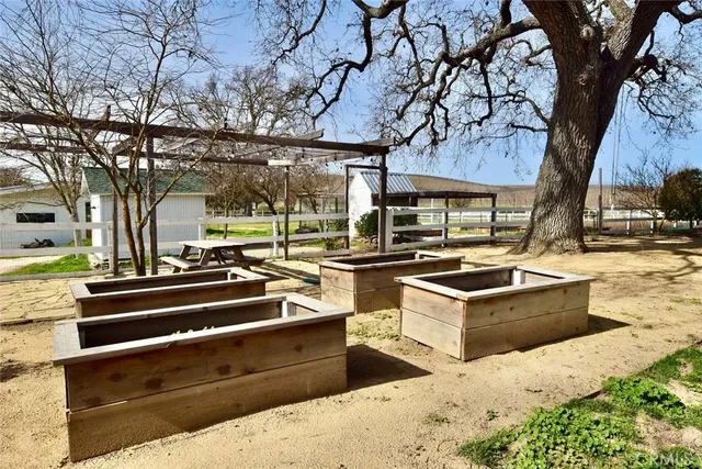 a view of a backyard with fountain and outdoor space