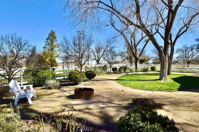 a view of a yard with swimming pool