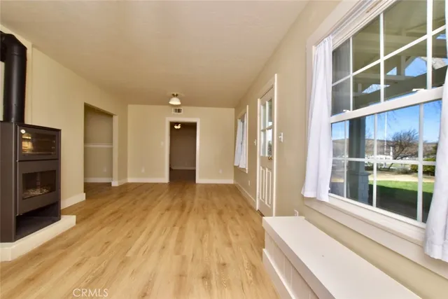 a view of a living room with a large window