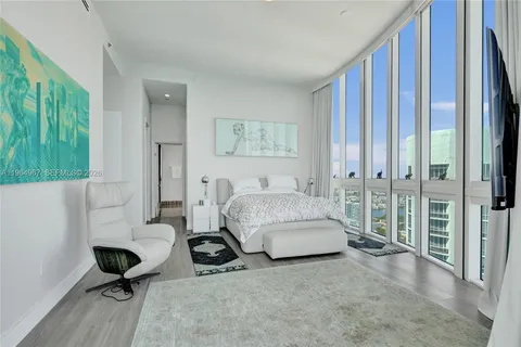 a bedroom with bed and a window