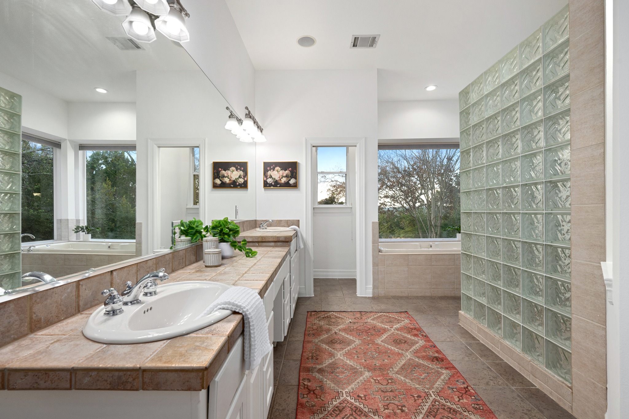 600 River Hills Road Austin, TX 78733 - Photo 20 of 40 Expanisve bathroom featuring a bathtub, double vanity, walk in shower and two enormous closets