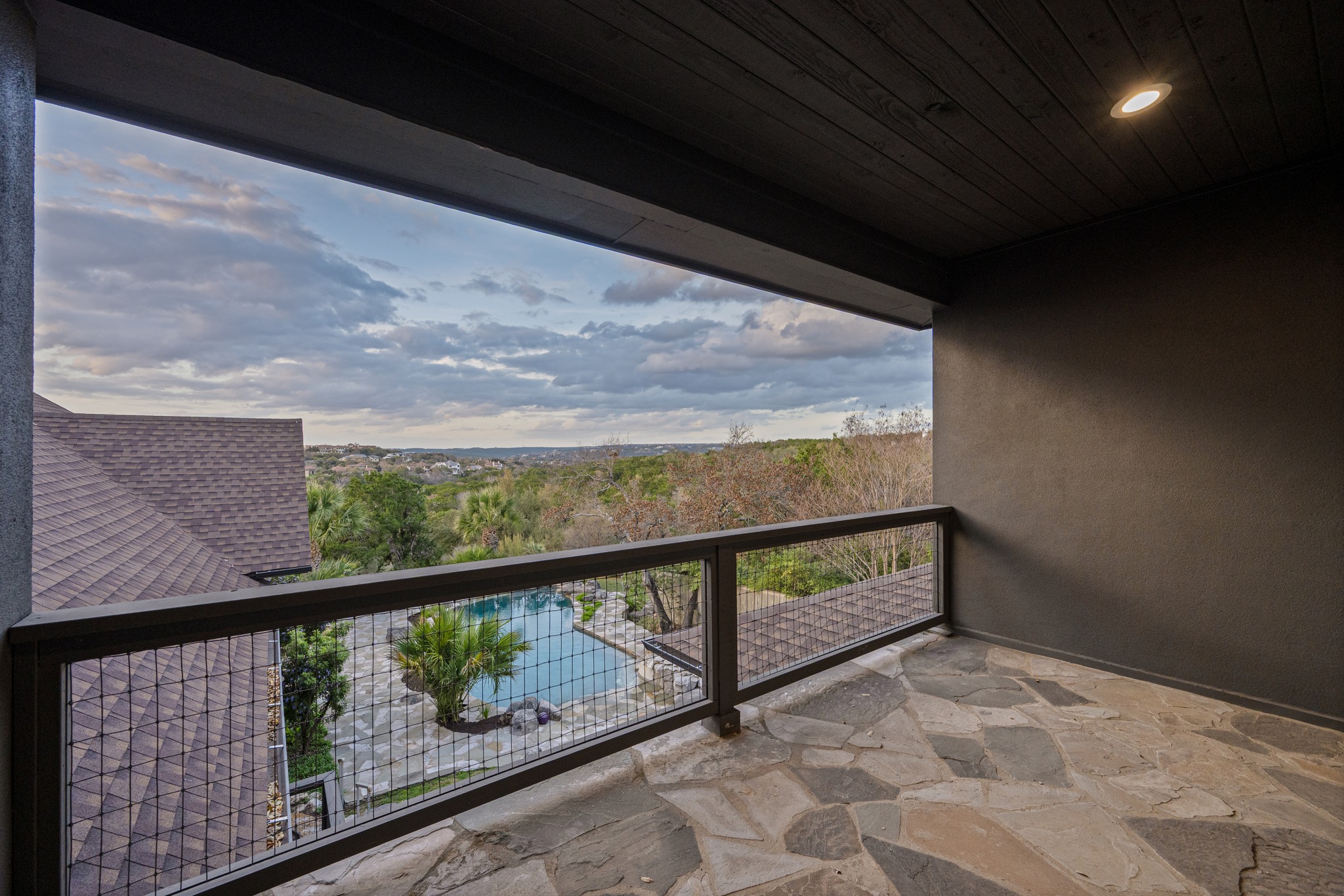 600 River Hills Road Austin, TX 78733 - Photo 27 of 40 Upstairs balcony with view of pool and hill country